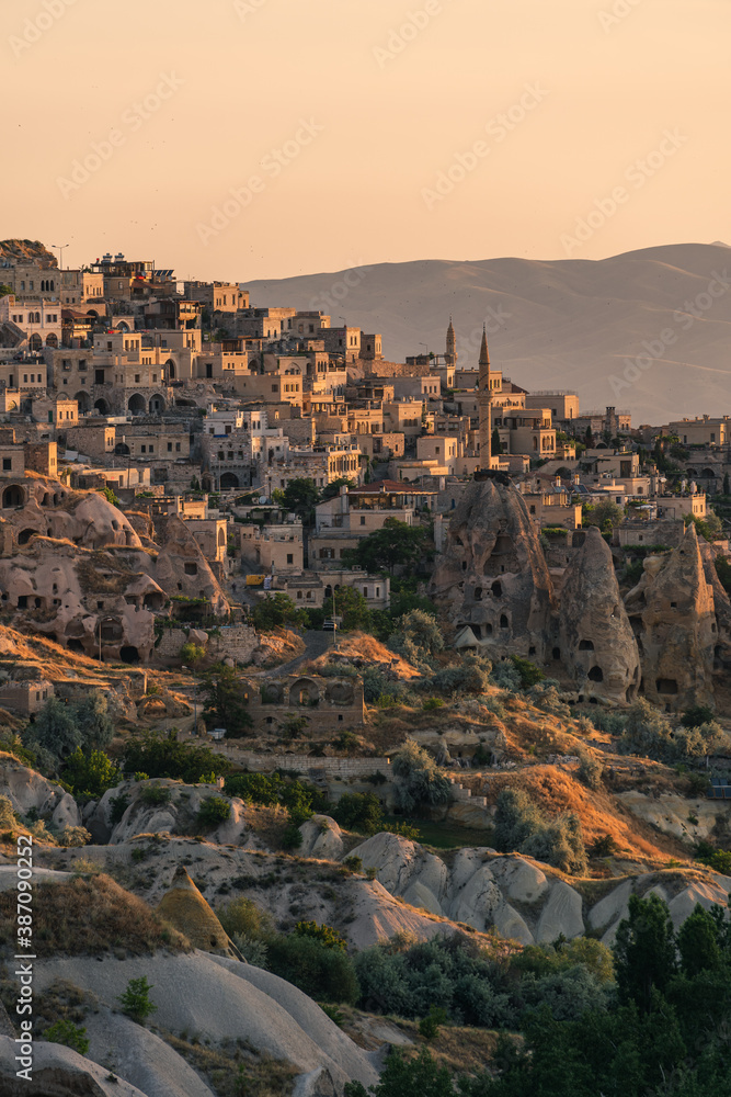 Small town on hill in Capadocia in a morning sunrise, central Anatolia region in summer season, Turkey