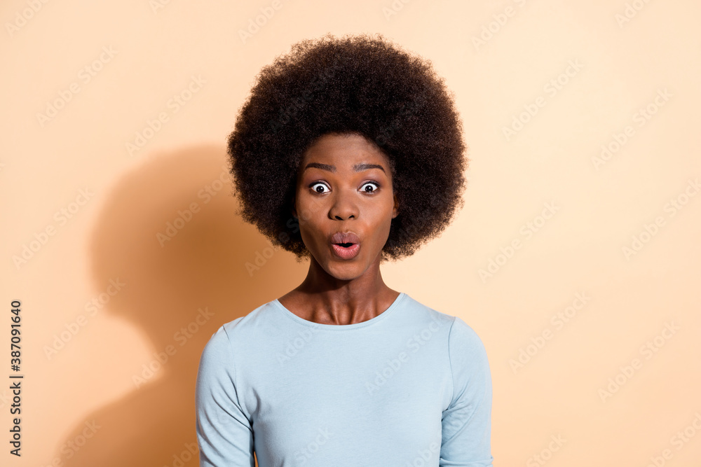 Photo portrait of shocked african american woman isolated on pastel beige colored background - obrazy, fototapety, plakaty 