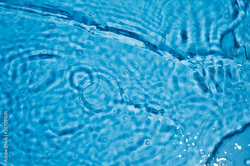 Blue water ripples and splashes. Blue water texture.