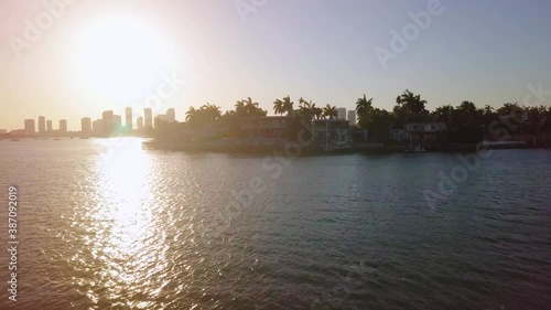 Aerial view over the Biscayne island, revealing San Marco isle and the Town Square Miami city, sunny morning, in the Venetian islands, Florida, USA - rising, drone shot photo