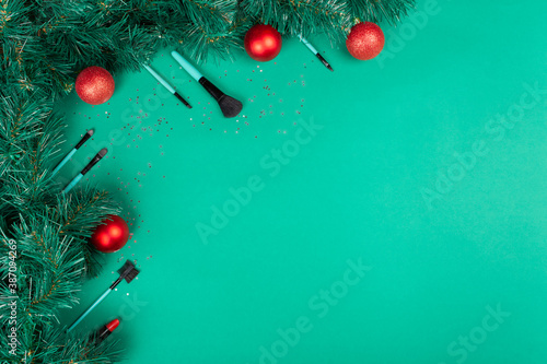 Christmas, New Year's background for make-up artist. brushes, Christmas decorations, spruce. Empty space for text.