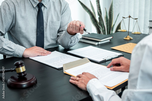 Male lawyer discussing negotiation legal case with client meeting with document contract in office, law and justice, attorney, lawsuit concept