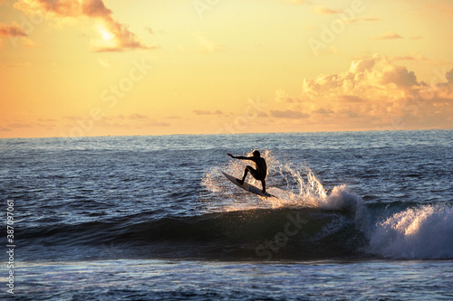Surfer in Samoa at Sunset