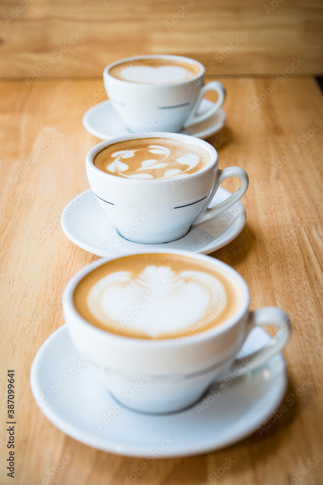 three cups of hot cappucino coffees three cups of hot cappucino coffees