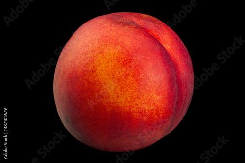 Ripe nectarine fruit on black