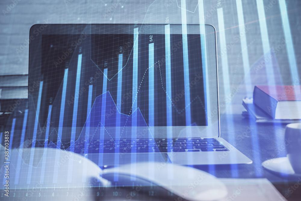 Stock market graph on background with desk and personal computer. Double exposure. Concept of financial analysis. Stock market graph on background with desk and personal computer. Double exposure. Concept of financial analysis.