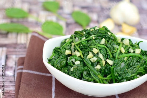 Sauteed garlic spinach. Healthy diet vegetarian