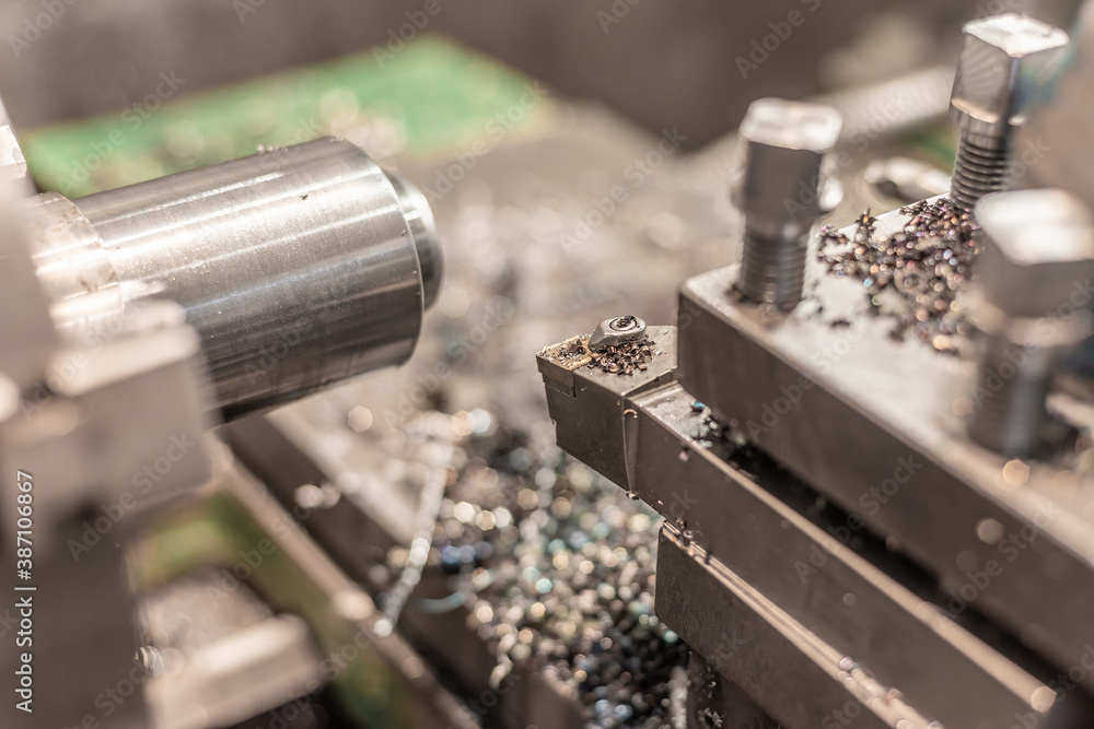 Lathe cutter on a machine tool close-up at a machine-building plant. Lathe cutter on a machine tool close-up at a machine-building plant.