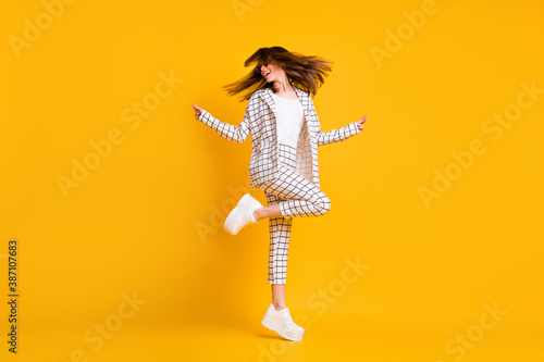 Full length body size side profile photo of girl wearing white checkered suit roung sunglass dancing isolated on vivid color background