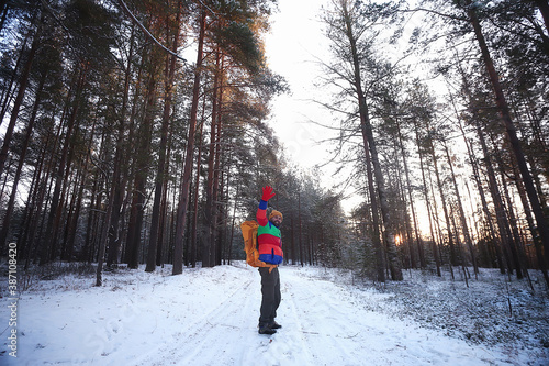 happy man winter forest waving hand gesture, winter view, extreme sport tourism