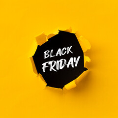 Black Friday text in paper hole teared in yellow paper over black background