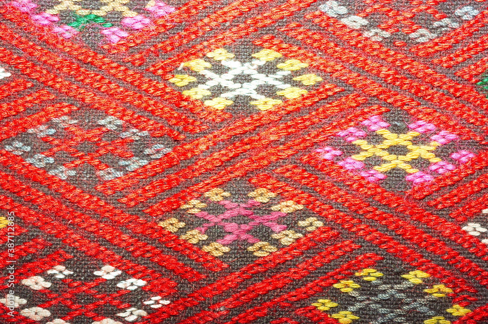 More than 100 years old colorful thai handcraft peruvian style rug surface old vintage torn conservation Made from natural materials Chemical free close up.