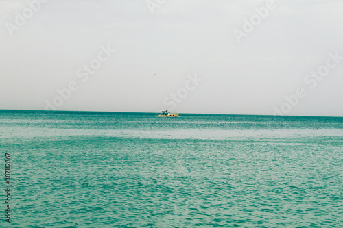 yellow boat on the sea