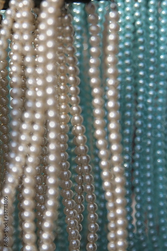 close-up of pearl necklace, graphic, with space for your own text