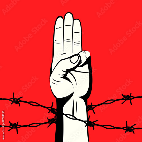 
The 3 finger salute protest sign behind barbed wire on red background vector illustration. Protest against violence, injustice and dictatorship. Fight for democracy