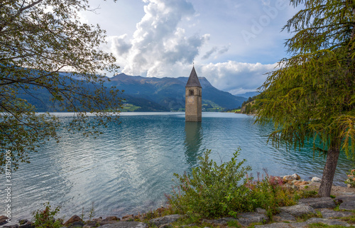 The bell tower of the sunken church in Curon, Resia Lake, Bolzano province, South Tyrol, Italy.