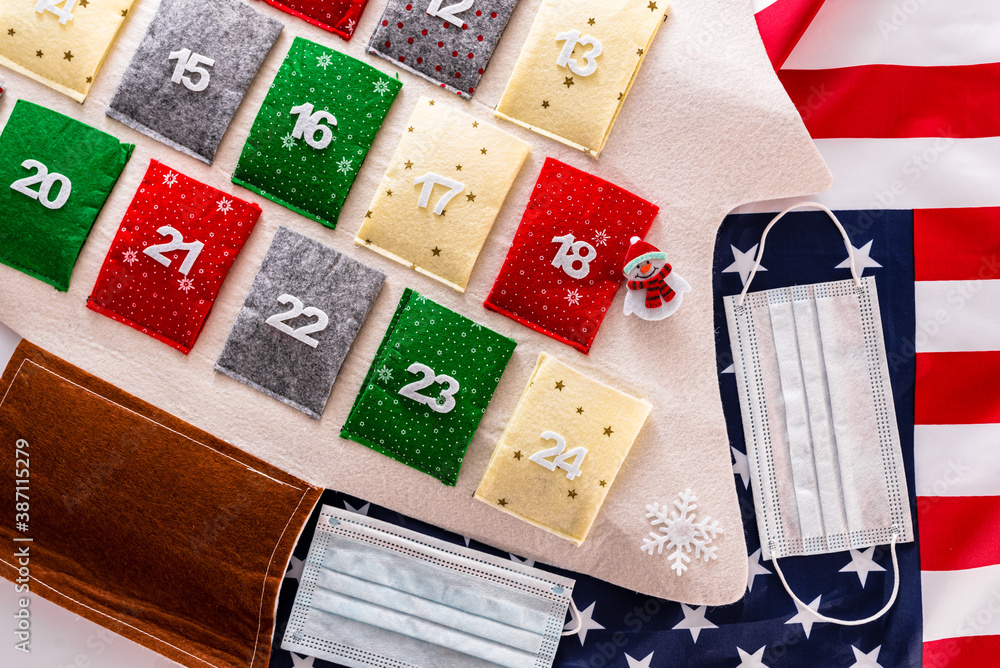 Fototapeta premium Christmas decorations for Christmas Eve with sanitary masks, seen from above.