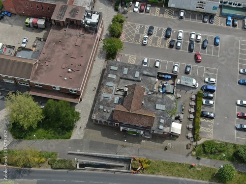 aerial view of small shopping precinct and car park 