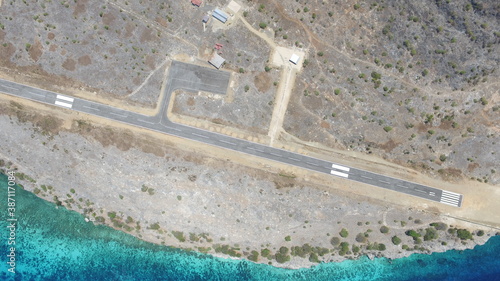 This is an airstrip on the island of Kisar which is close to the ocean and looks so beautiful photo