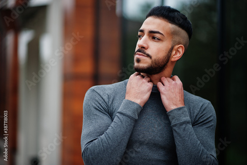 Portrait of stylish arab beard man wear grey turtleneck. Arabian model guy.