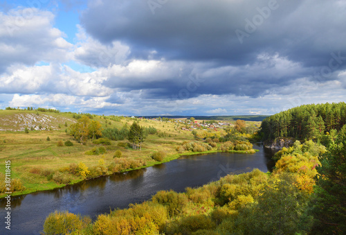 Picturesque landscape. The Rezh River in the green banks. Middle Urals. Russia. Russian nature. Autumn Ural.