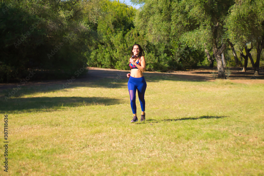 woman running in the sunny park