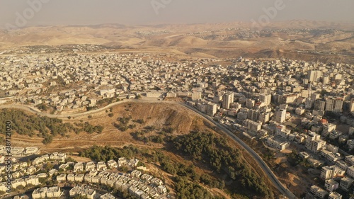 Israel and Palestine divided by Security wall Aerial view Aerial view of Left side Anata Palestinian town and Israeli neighbourhood Pisgat zeev 