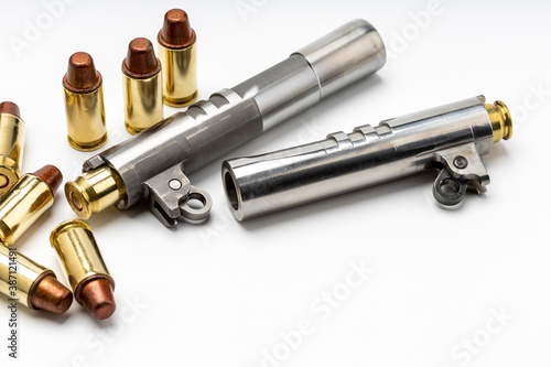 Automatic handgun barrels and .45 bullets on white background , Semi wadcutter bullets photo