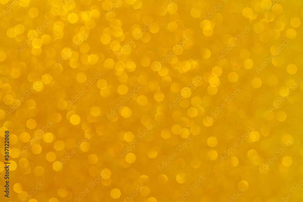 Abstract golden background. Beautiful bokeh effect. Light circles background.