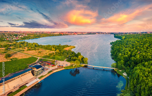 View from flying drone of Ternopil lake. Spectacular summer sunset on Seret river. Wonderful morning cityscape of Ternopil town, Ukraine, Europe. Traveling concept background.