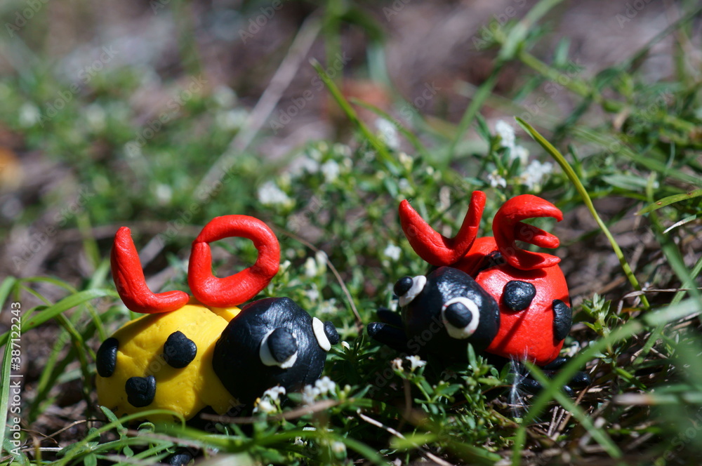 Figures of two ladybirds. Next to it is the inscription love. Figures of two ladybirds. Next to it is the inscription love.