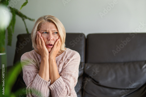 Close up Portrait Sad Senior Woman Sitting on Sofa