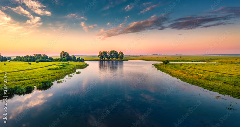 Fabulous summer sunrise on Stara Brykulia lake, Ternopil region. Perfect rural scene from flying drone of Ukrainian countryside. Traveling concept background.
