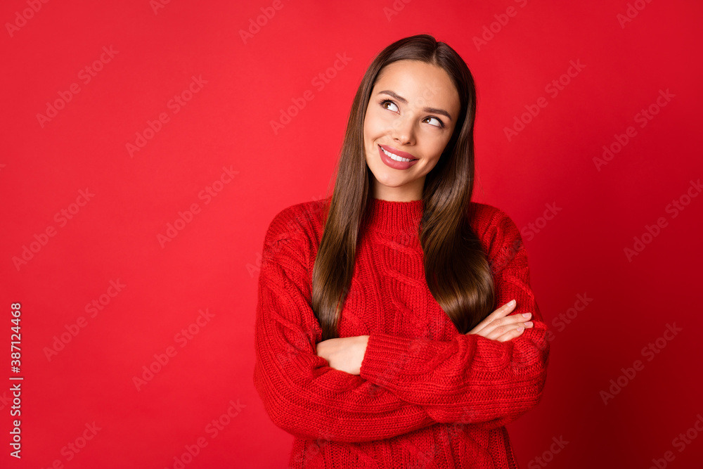 Obraz premium Photo of girl cross hands look empty space think thoughts wear sweater isolated on shine red color background