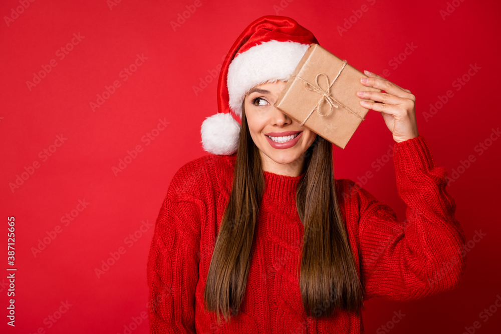 Fototapeta premium Close-up portrait of her she nice attractive pretty charming cheerful girl holding in hands giftbox closing eye discount copy space isolated over bright vivid shine vibrant red color background