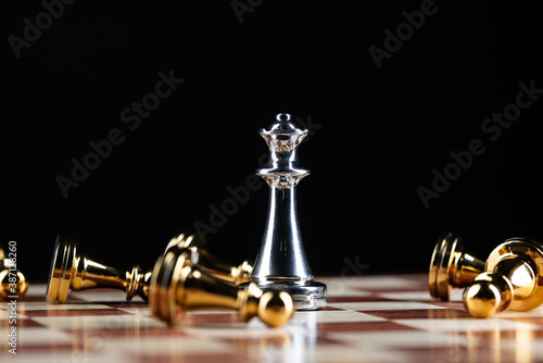 Silver queen chess defeats gold pawns on board.