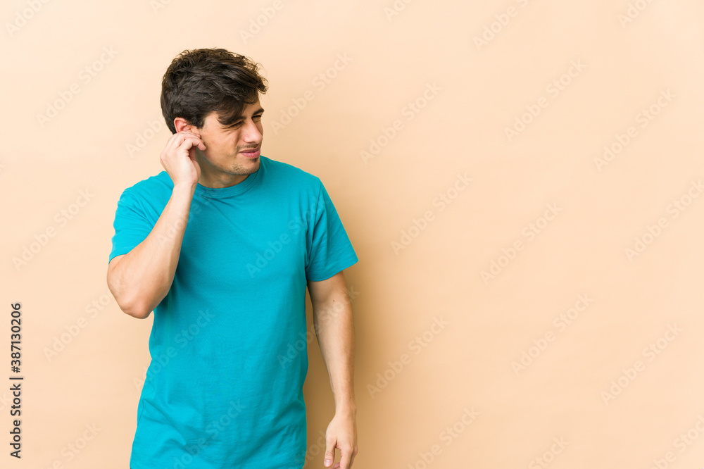 Young cool man covering ears with fingers, stressed and desperate by a loudly ambient. Young cool man covering ears with fingers, stressed and desperate by a loudly ambient.