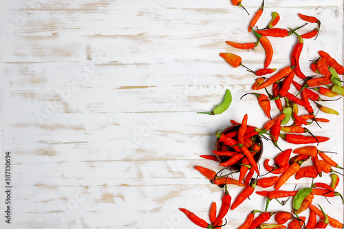 red hot peppers on wooden background
