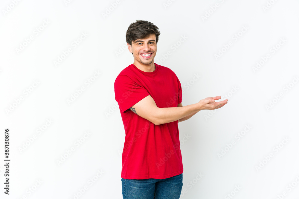 Young cool man holding a copy space on a palm. Young cool man holding a copy space on a palm.