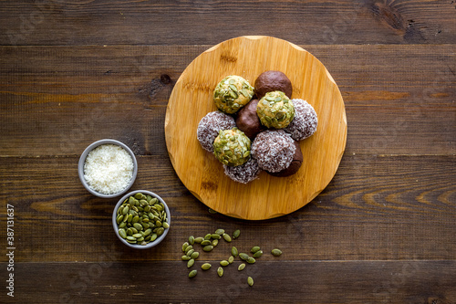 Raw energy balls with coconut and pumpkin seeds, top view