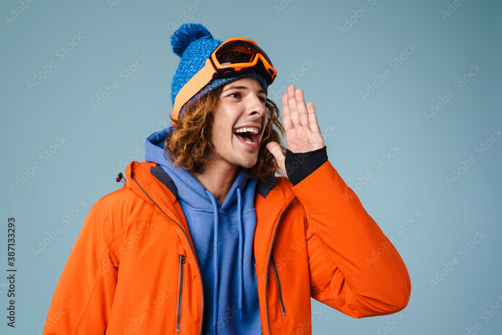 Caucasian joyful sportsman looking and screaming aside Caucasian joyful sportsman looking and screaming aside