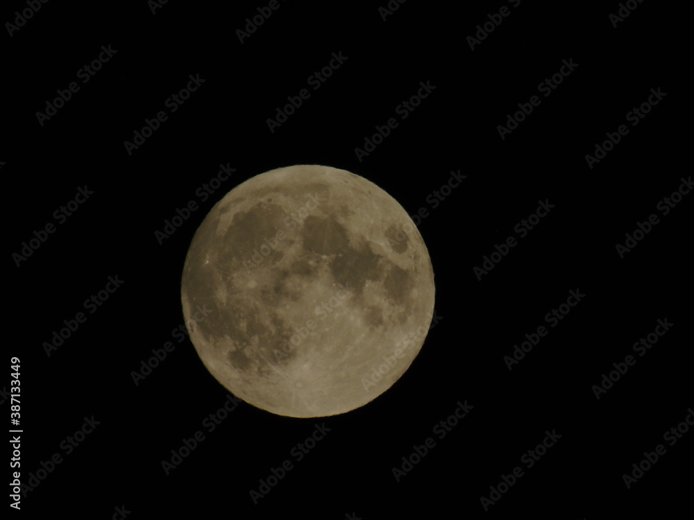 Genova, Italy - 09/25/2020: An amazing photography of the full moon over the city of Genova by night with a great clear sky in background and some stars Genova, Italy - 09/25/2020: An amazing photography of the full moon over the city of Genova by night with a great clear sky in background and some stars