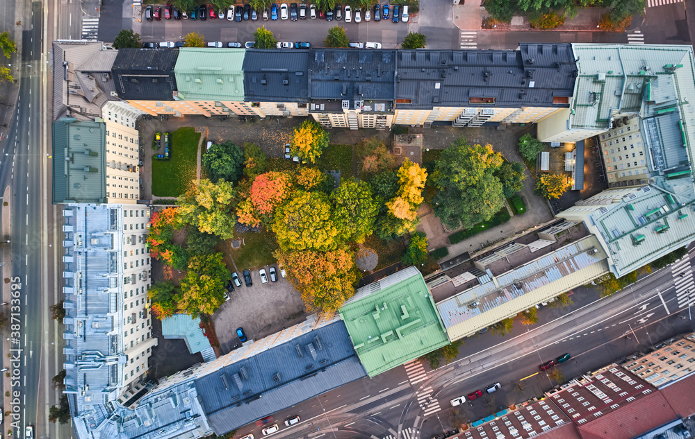 Aerial view of the back yards of old apartment buildings in Central Helsinki, Finland. Autumn cityscape.