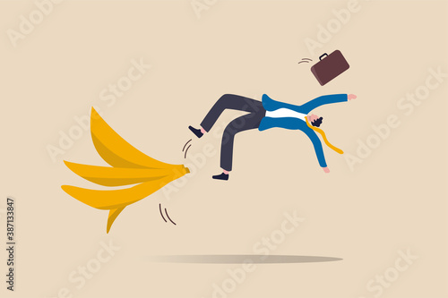 Business mistake or accident, insurance, disaster suddenly happened without warning or risk and danger in investment concept, businessman running and slipping with big banana peels on the ground.