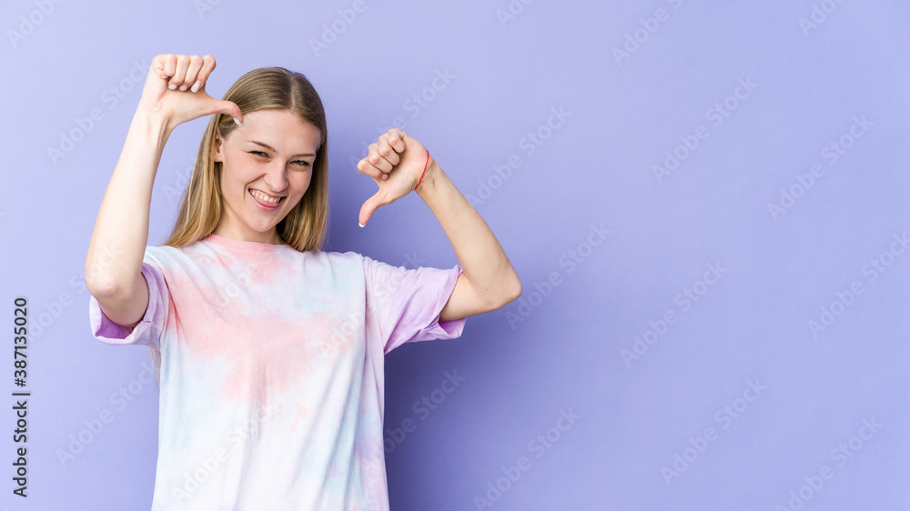 Young blonde woman isolated on purple background feels proud and self confident, example to follow. Young blonde woman isolated on purple background feels proud and self confident, example to follow.