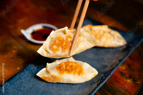 Cooking delicious original Japanese meat Gyozas. photo