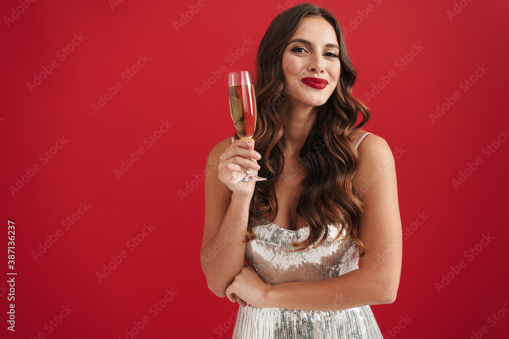 Charming happy girl in evening dress smiling and holding champagne glass Charming happy girl in evening dress smiling and holding champagne glass