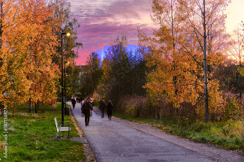 Obraz na płótnie Pedestrian path in Kluuvi central district of Helsinki in Autumn fall. Beautiful sunset and blue light for Helsinki Hall on the background, Finland. w salonie