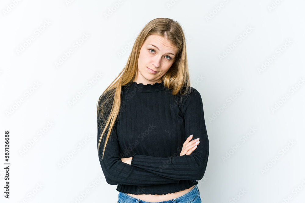 Young blonde woman isolated on white background who is bored, fatigued and need a relax day. Young blonde woman isolated on white background who is bored, fatigued and need a relax day.