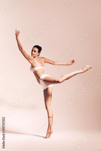 ballerina dancing in sepia studio